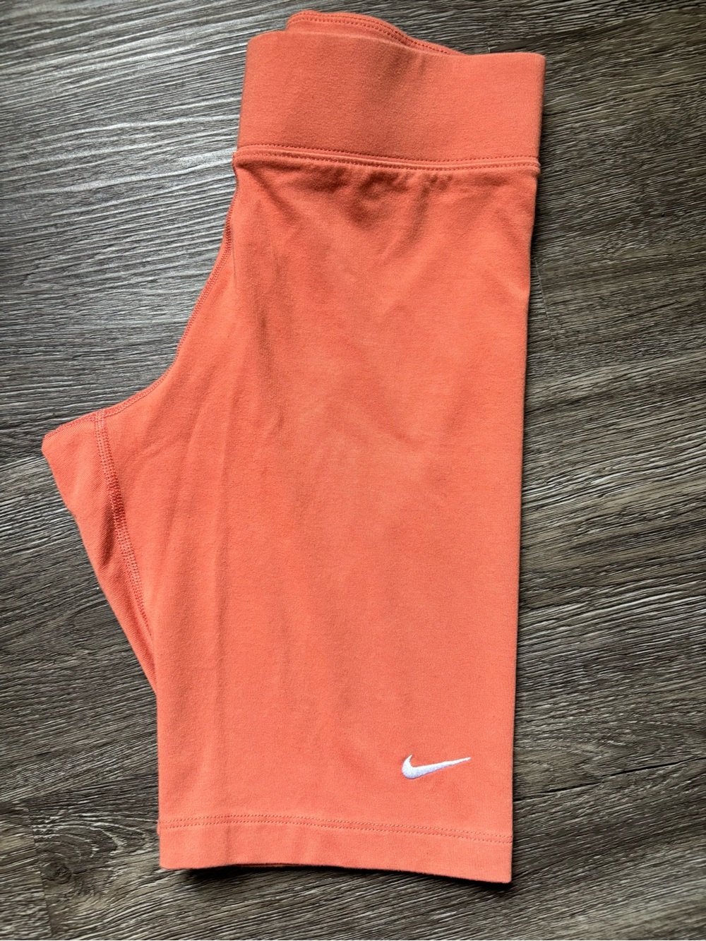 Nike Orange Bike Shorts with White Swoosh Logo